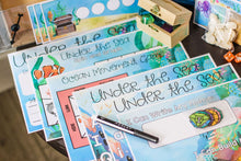 Load image into Gallery viewer, Under the Sea Math Mat, Under the Sea Spin and Graph, Ocean Movement Game, Under the Sea "AB-Sea" Mats, and a Name Practice Mat for the Ocean Explorer Learning Kit.
