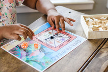 Load image into Gallery viewer, Student spinning the spinner on the Ocean Movement Game.